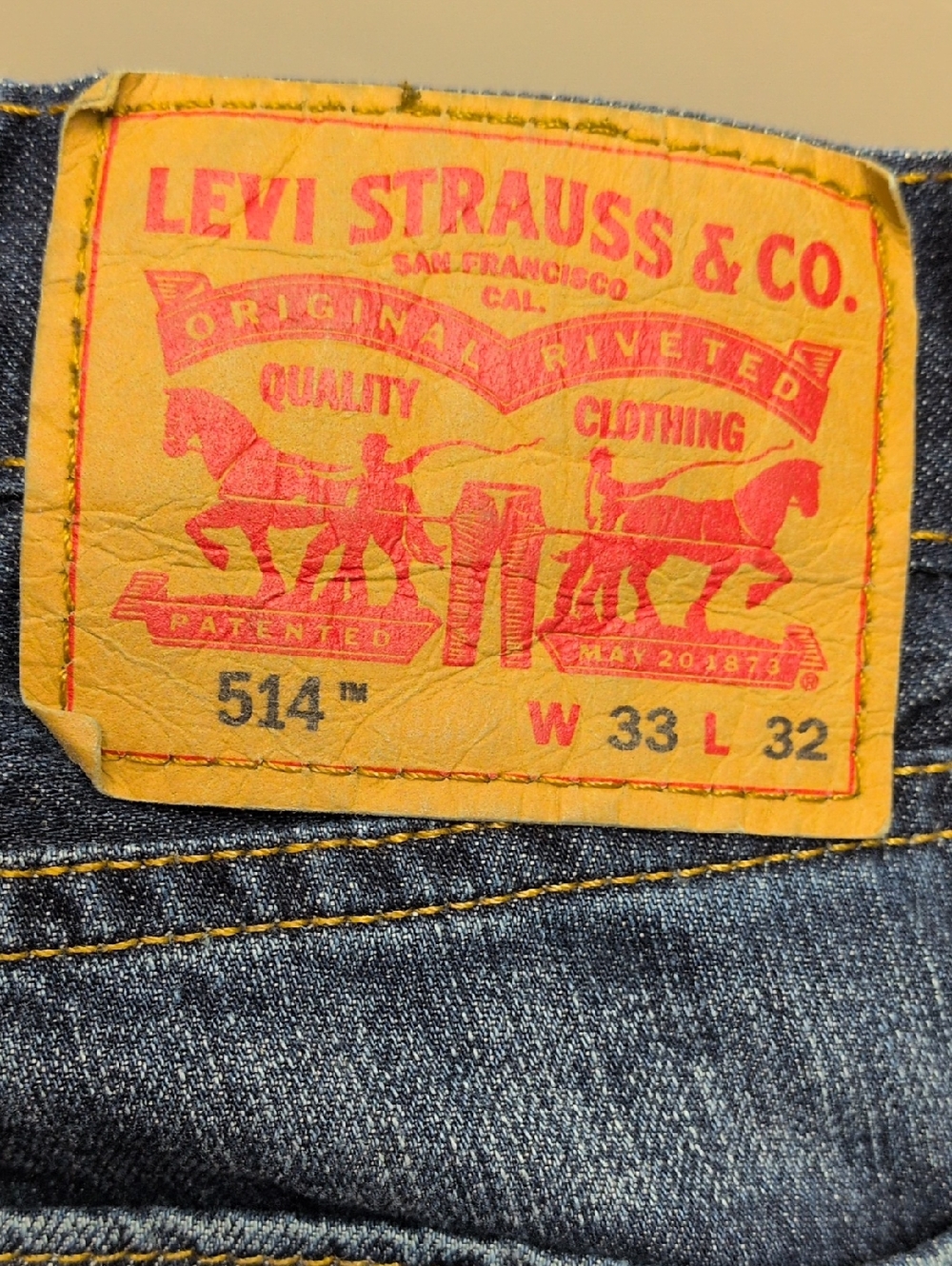 Levi's Men's Slim Jeans in Dark Blue with Tan Patch